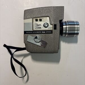 The Revere Model 118D Eye Matic 8mm Movie Camera Power Zoom Telephoto Wide Angle